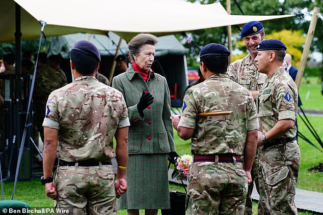 Princess Anna wore an army green plaid skirt suit for her outing today.