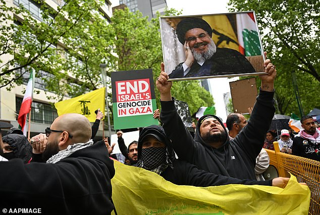 Melbourne protesters also waved Hezbollah's yellow and green flag.