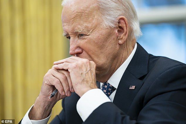 US President Joe Biden pauses as he speaks from the Oval Office.