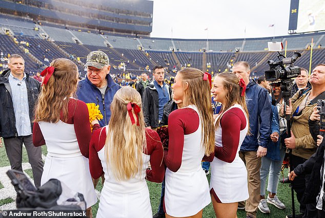 Tim Walz chats with cheerleaders at Saturday's football game