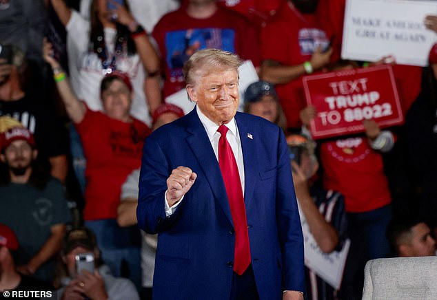 Valleau pulled out a knife and lunged at the mailman. But she quickly deterred this attack by pulling out her postal service-issued pepper spray, Law & Crime reported. PICTURED: Trump at a campaign event at Macomb Community College in Warren, Michigan, on September 27.