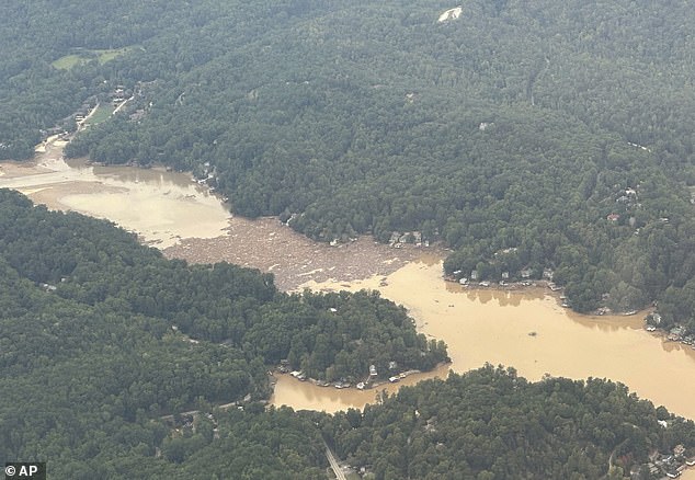 Debris from the storm can be seen in the waters of Lake Lure in Rutherford County, near the village of Chimney Rock, as seen from above from a North Carolina National Guard aircraft on Monday.