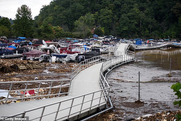 The river empties into Lake Lure, which was filled with the remains of houses, trees and other debris.