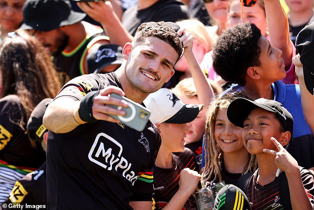 Cleary didn't seem concerned about his shoulder problem as he took selfies with fans at a training session ahead of the NRL grand final.