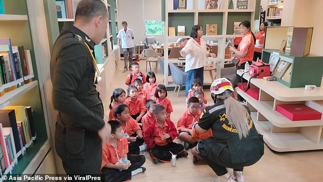 Firefighters took some of the children who managed to escape the fire to a nearby building, where they were seen being counted.