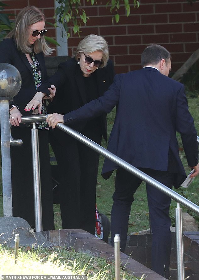 They had to help her out of her wheelchair and down the church stairs to the service.