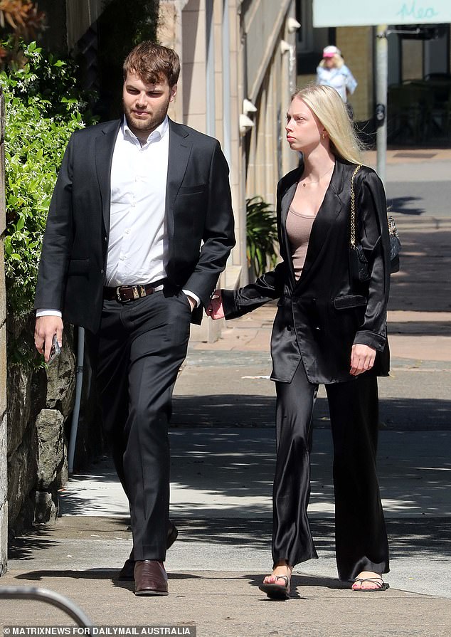 Lizzie Buttrose's youngest son, James Spira, and a companion are seen arriving.