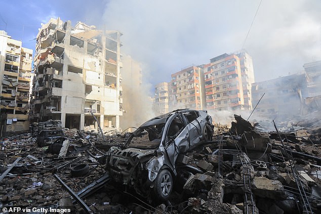 Smoke rises from the rubble of a building at the site of an overnight Israeli airstrike in the Laylaki neighborhood in the southern suburbs of Beirut on October 1, 2024.