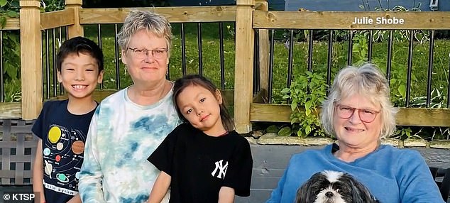 Kwok is pictured with two of his grandchildren and his sister Julie.