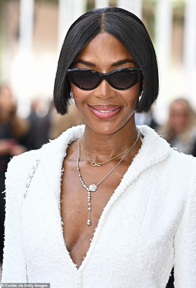 Greeting viewers, Naomi looked typically chic in a cream wool jacket and sunglasses.