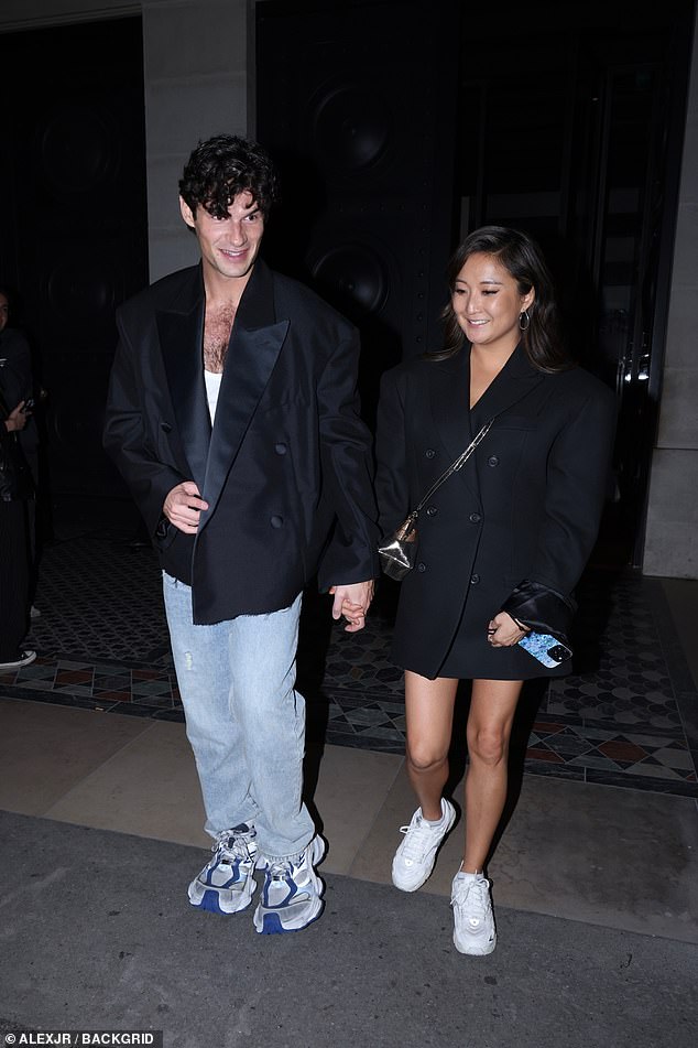 The couple wore black jackets and matching trainers as they arrived in the French capital for their night out.