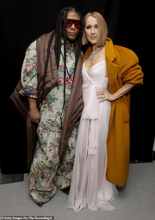 Roach with Celine Dion at the Grammys earlier this year. In his new book, he talks about supporting his two younger brothers after their mother died.