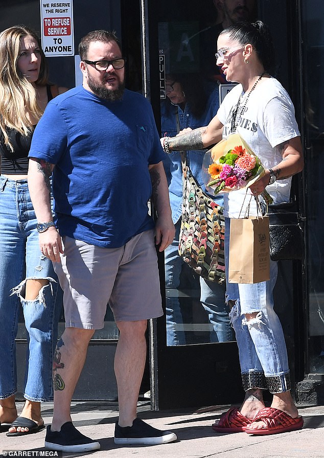 The couple appeared in love and deep in conversation, after Chaz, 55, bought Shara a colorful mixed bouquet which she held as they left the restaurant on Sunday.