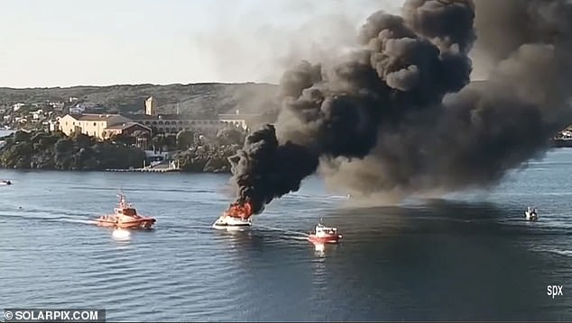 Dramatic footage showed coastguards who came to the rescue trying to put out the fire with high-pressure water jets as a huge plume of black smoke rose into the air.