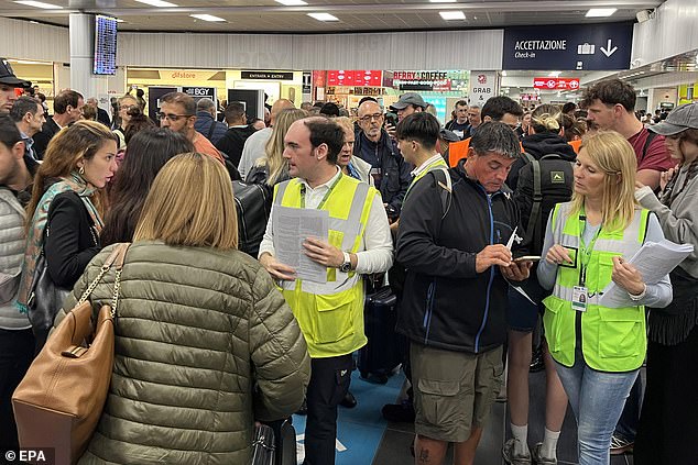 Passengers wait for their flights at Orio al Serio airport after the closure of Milan-Bergamo airport over the incident