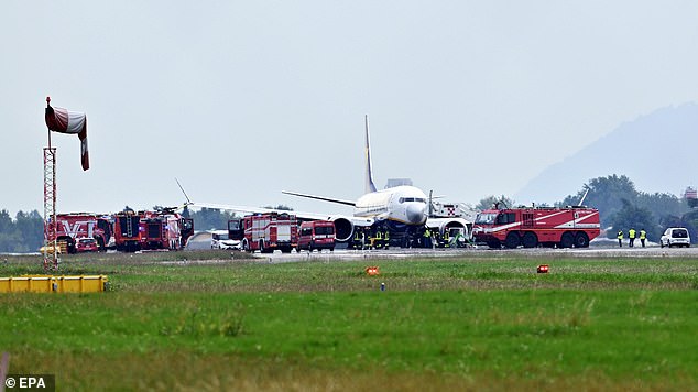 Emergency services go to the scene of the dramatic landing on Tuesday.