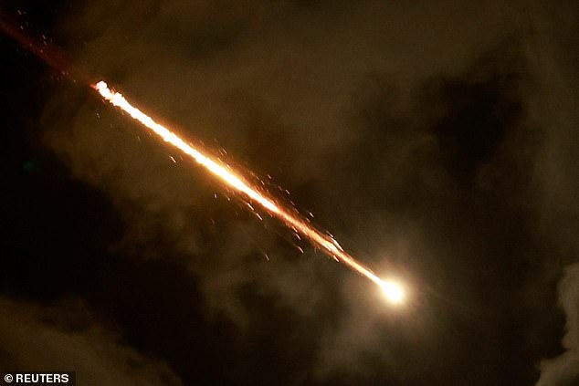 A rocket flies in the sky over Tel Aviv.