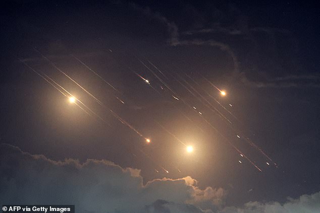 This image shows projectiles intercepted by Israel near the northern town of Baqa al-Gharbiya on October 1, 2024. Air raid sirens sounded in central Israel on October 1, the military said, a day after the army to launch ground operations in southern Lebanon against Hezbollah positions. 'Sirens sounded in central Israel,' the military said, without providing details of the affected areas