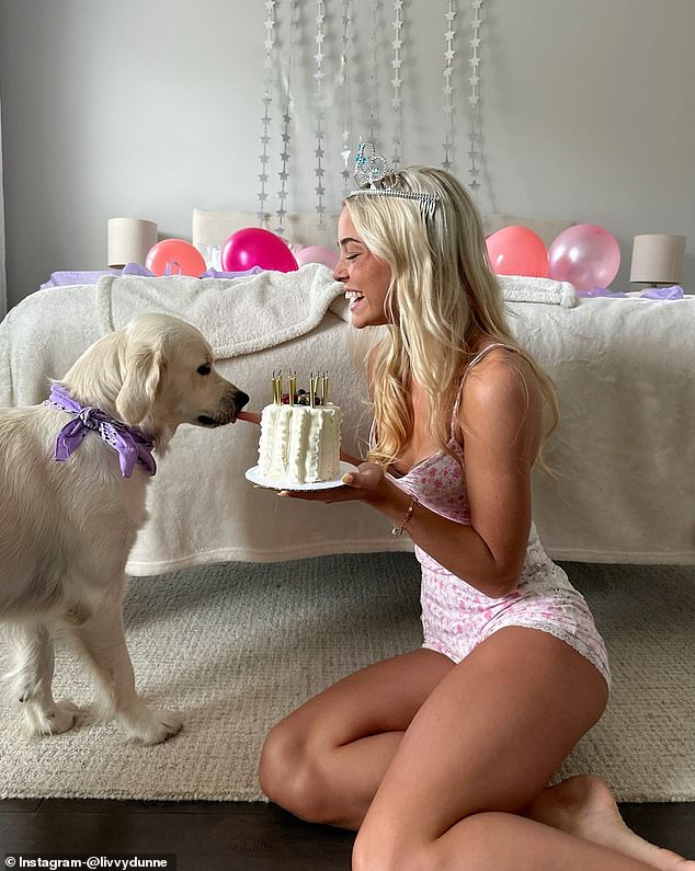 In one image, she laughed as she sat on the floor and showed a cake to her dog, Roux.