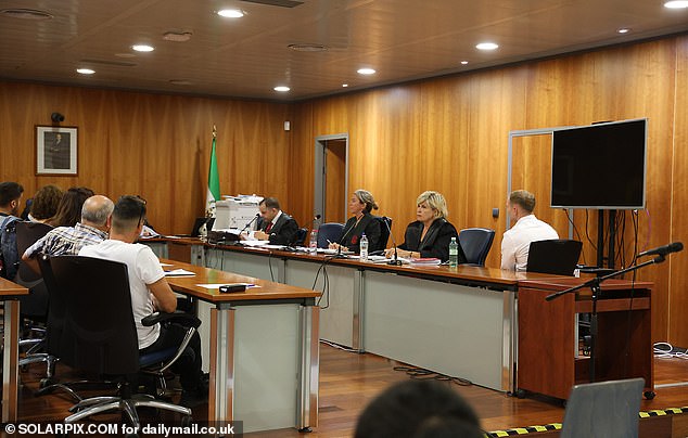 Lewis Briggs, right, is seen wearing a white shirt in court last week.