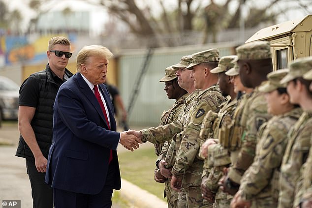 Republican presidential candidate Former President Donald Trump greets members of the National Guard at the US-Mexico border on February 29, 2024.