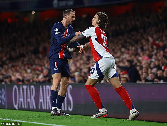 Riccardo Calafiori (right) and Fabián Ruiz (left) collide the ball after a referee's decision