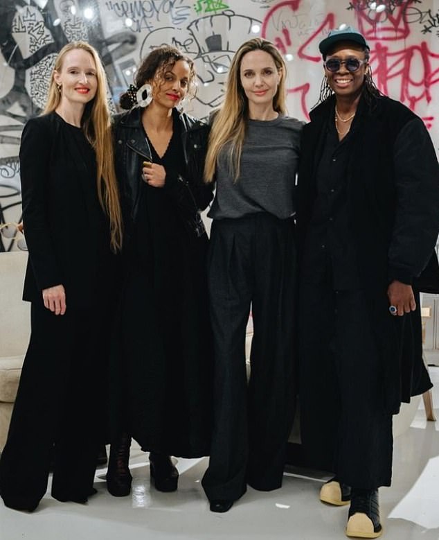 Here she is seen with several artists at an event for artist Mickalene Thomas at Atelier Jolie.