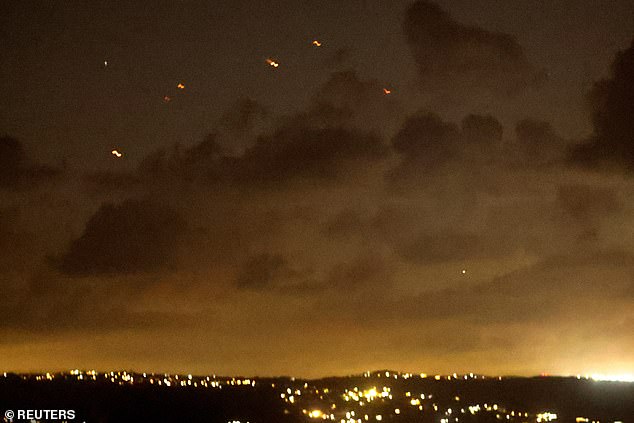 Projectiles fly in the sky after Iran fired a salvo of ballistic missiles at Israel amid ongoing hostilities between Hezbollah and Israeli forces.