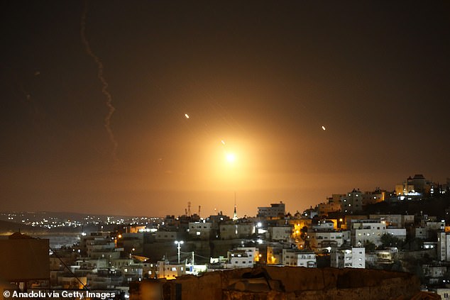 Many rockets, fired from Iran, are seen over Jerusalem from Hebron, West Bank.