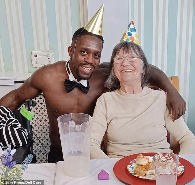 Chris served lit birthday cakes on the table and added lemonade. Pictured: Chris with resident Liz Brown.