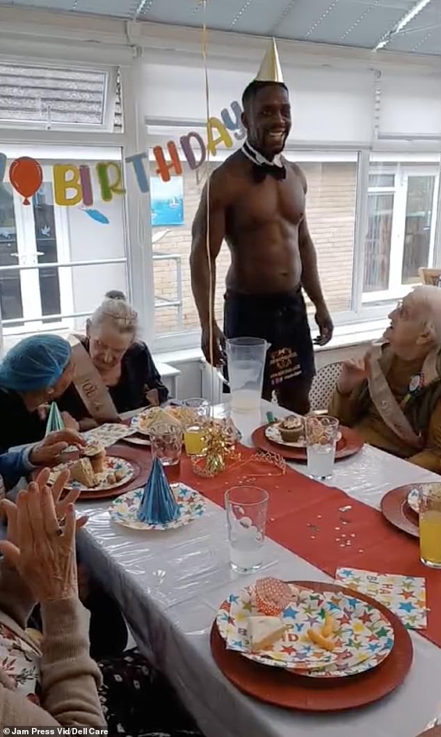 He helped Margaret (far left) blow out the candles while the rest of the table full of friends and staff cheered and applauded.