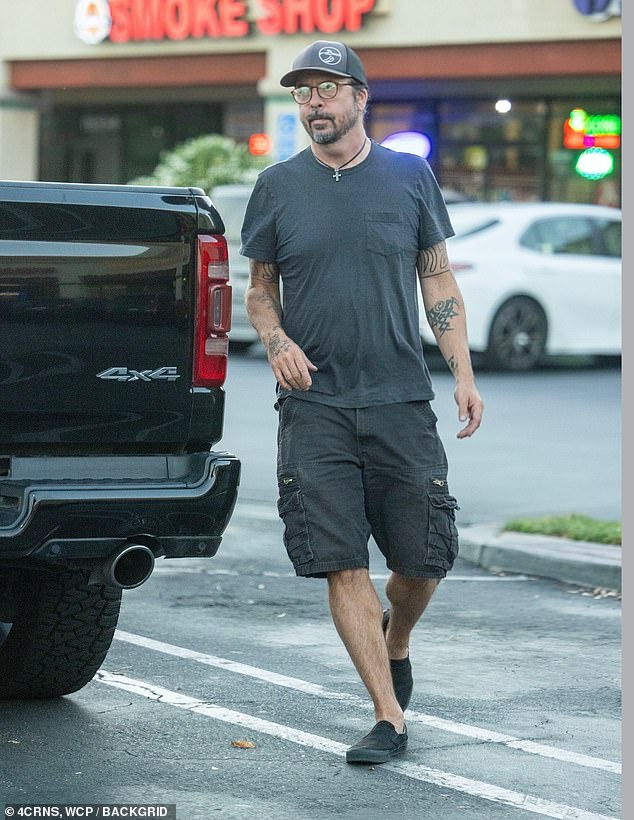 The former Nirvana drummer sported a casual outfit for the outing, wearing a gray t-shirt, black shorts and a baseball cap.