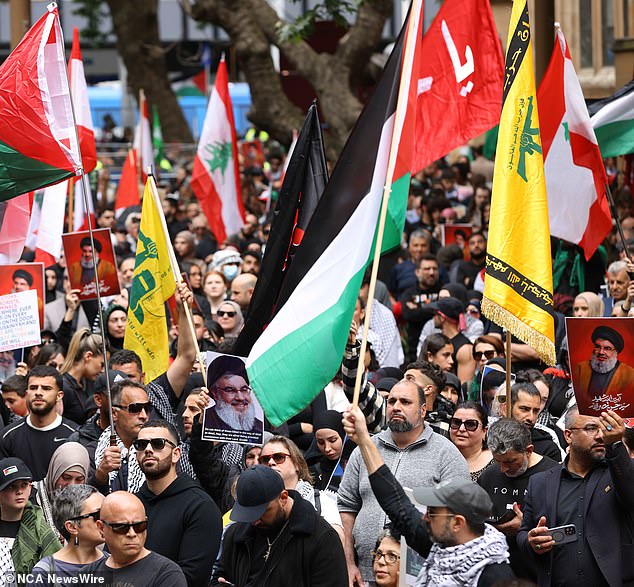 Small groups of young people, many of them masked, were seen at demonstrations in each city waving the red and green flags of Hezbollah, a militant and political group from Lebanon that has been listed as a terrorist organization in Australia.