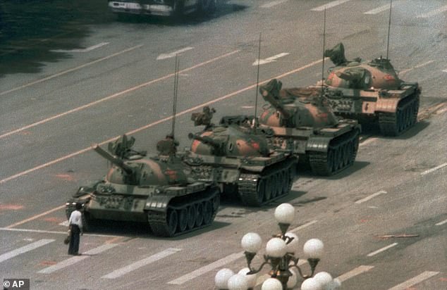 In this file photo from June 5, 1989, a Chinese man stands alone to block a line of tanks heading east on Beijing's Changan Boulevard. in Tiananmen Square.