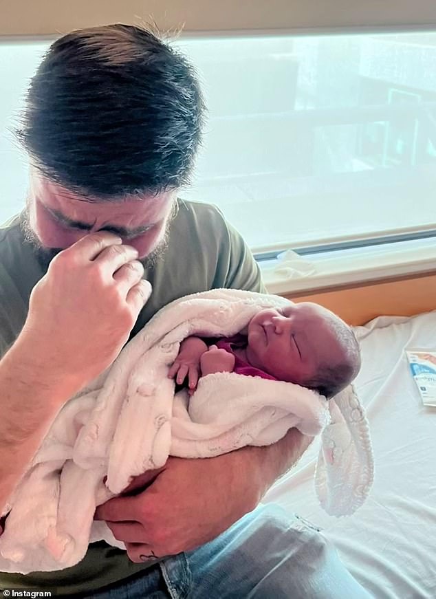 One sweet photo showed Matty, overcome with emotion and wiping away tears as he held his granddaughter.