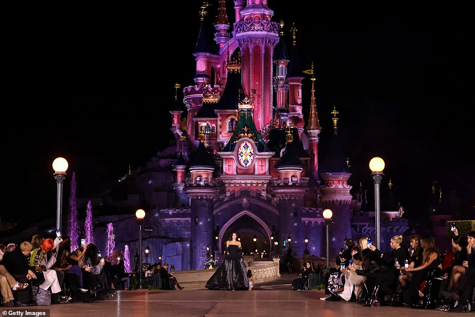 Showing off her incredible figure, Kyle wowed with her spectacular look as she strutted down the huge catwalk, with the famous Disney Castle in view behind her.