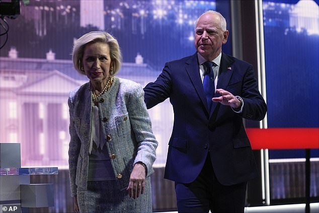 Democratic vice presidential candidate Minnesota Governor Tim Walz and his wife Gwen Walz exit the stage after a vice presidential debate.