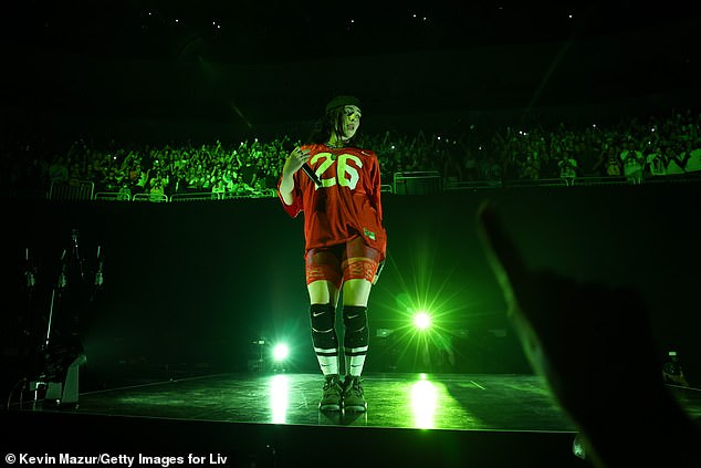 Billie Eilish photographed performing the Guess remix from Charli XCX's album Brat on her Hit Me Hard and Soft world tour on September 29.