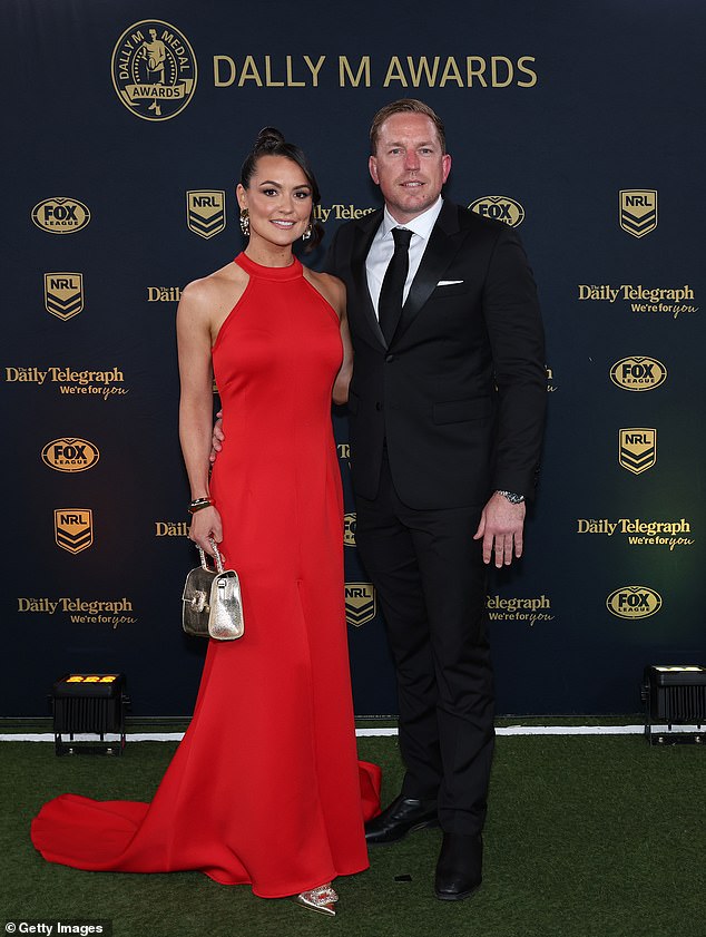 Retired Roosters star Mitch Aubusson looked dapper in a black and white suit alongside his stunning wife Laura Aubusson.