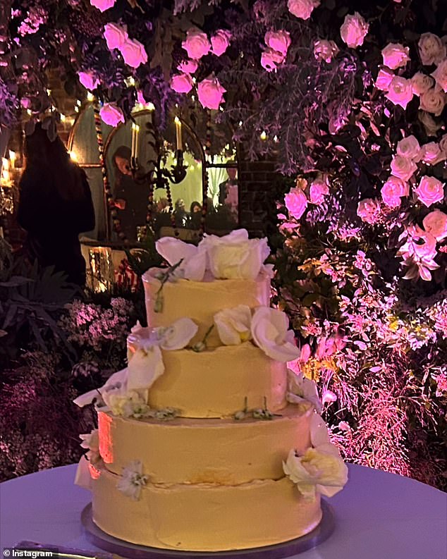 The bride and groom were presented with a four-tier wedding cake during Sunday's event.