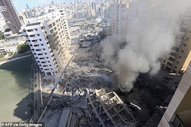 Dust and smoke rise from the site of an overnight Israeli airstrike in the southern Beirut suburb of Shayyah, October 2, 2024. At least five Israeli strikes hit Beirut's southern suburbs early in the year. October 2.