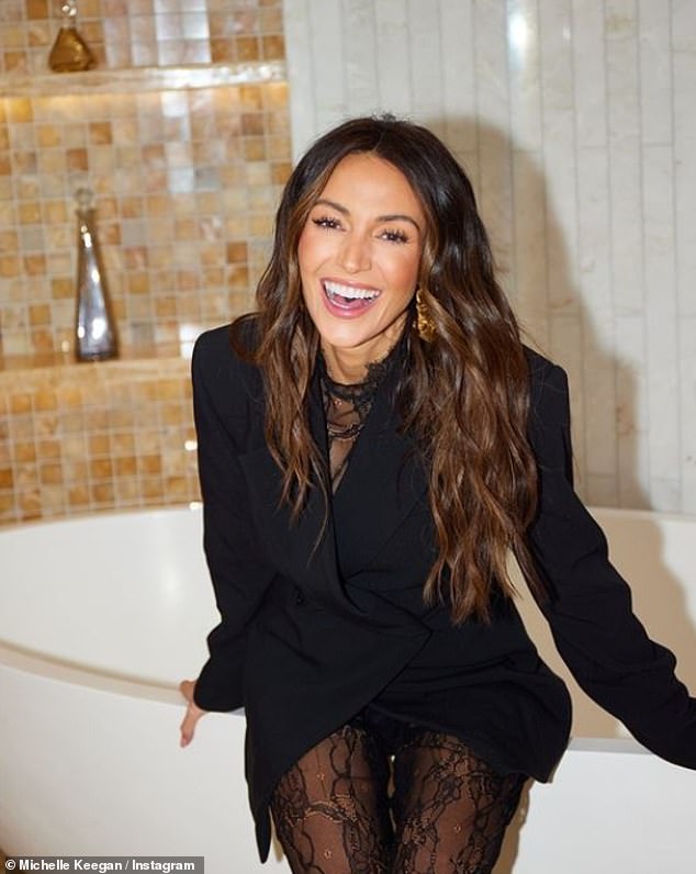 The Our Girl actress was all smiles as she showed off her new outfit while sitting in a luxurious bathtub.