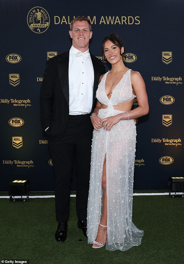 Kaylah Collins, the partner of Lindsay Collins of the Roosters, shined in a white dress that accentuated her chest and waist. After welcoming a baby girl in June, the new mom dazzled