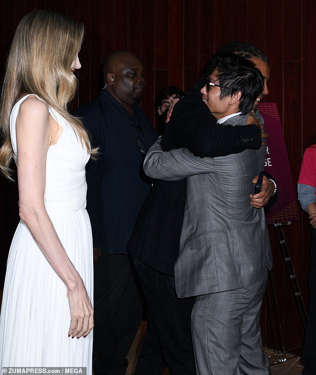 Angelina watched with pride as Akala and her son Pax, 20, shared a sweet hug at the event in New York.