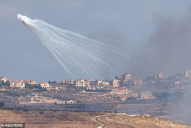 The Israeli army fires artillery into Lebanon, amid cross-border hostilities between Hezbollah and Israel, as seen from Jish, northern Israel, on October 2, 2024.