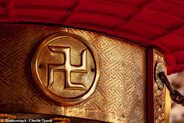 A close-up of a swastika at Asakusa Shrine in Tokyo, which has been used for centuries to indicate temples.