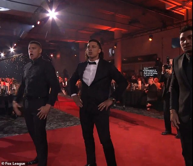 The trio advanced towards the stage where the prize winners were standing to perform the Haka.