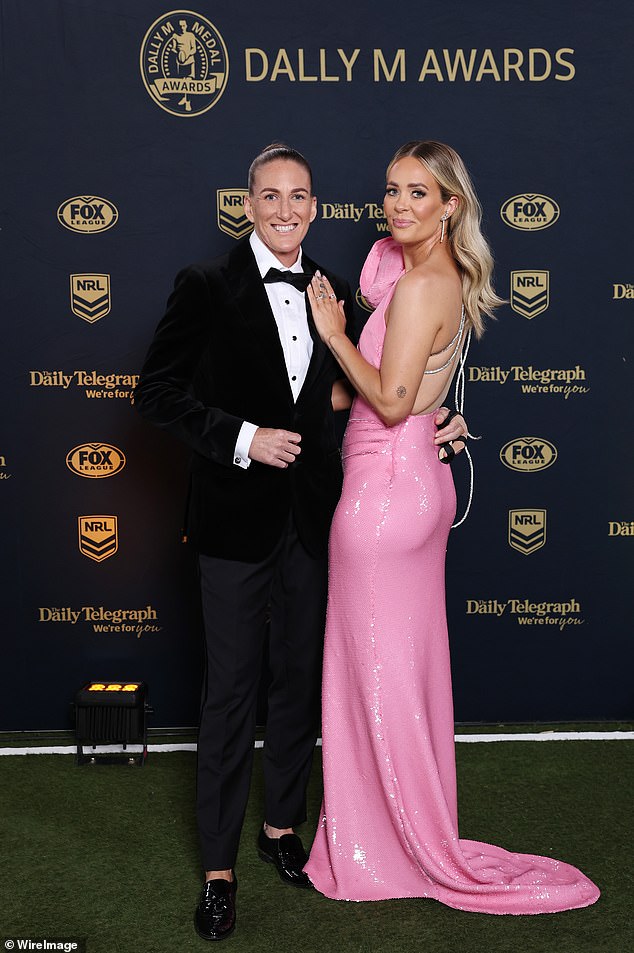 Meanwhile, his wife Katy wowed in the bright pink dress which had diamond-encrusted straps down the back.