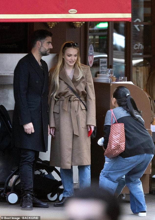 The couple was seen chatting outside the restaurant.