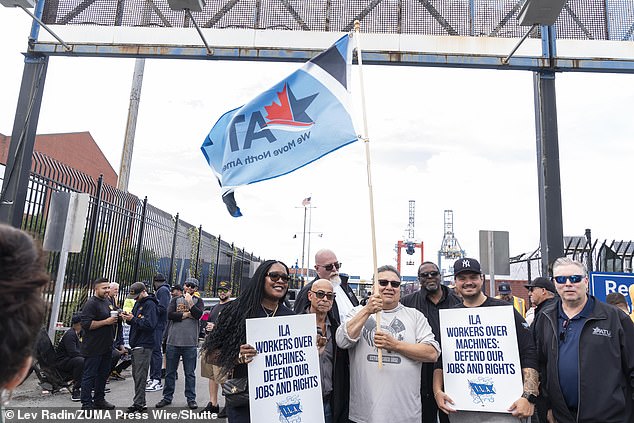 Workers seen on a picket line for longshoremen at the Red Hook terminal in Brooklyn, New York, on October 1, 2024, seeking more wages and limits on automation.